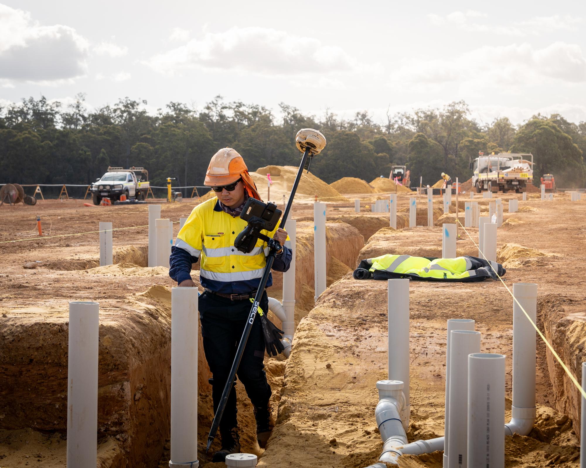 Collaborative surveying team working on a complex mining site project in WA